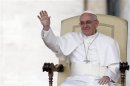 Pope Francis waves as he leads the weekly general audience in Saint Peter's square, at the Vatican
