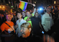 Revelers celebrate in Manhattan's west village following the passing of the same sex marriage bill by a vote of 33 to 29, Friday, June 24, 2011, in New York. Same-sex marriage is now legal in New York after Gov. Andrew Cuomo signed a bill that was narrowly passed by state lawmakers Friday, handing activists a breakthrough victory in the state where the gay rights movement was born. (AP Photo/Louis Lanzano)