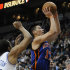 New York Knicks' Jeremy Lin, front right, lays up for two of his 20 game points on a shot in the second half of an NBA basketball game against the Minnesota Timberwolves, Saturday, Feb. 11, 2012, in Minneapolis.  Timberwolves' Wayne Ellington, left, and J.J. Berea, right, defend. The Knicks won 100-98. (AP Photo/Jim Mone)