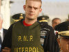 FILE - In this June 4, 2010 file photo, Dutch citizen Joran van der Sloot is escorted by police outside a police station near the border with Chile in Tacna, Peru.  Joran van der Sloot goes on trial in the murder of a young Peruvian woman on Friday Jan. 6, 2011, nearly seven years after he became the prime suspect in the unsolved disappearance of an American teenager on holiday in Aruba. Van der Sloot, 24, is charged with killing 21-year-old Stephany Flores in his Lima hotel room on May 30, 2010, after the two left a casino together in the day's wee hours. (AP Photo/Karel Navarro, File)