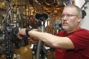 Steve Schlegel, owner of Schlegel Bicycles, answers a question while working on a bicycle in the shop's pro shop, in Oklahoma City, Thursday, Jan. 26, 2012. (AP Photo/Sue Ogrocki)