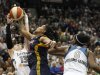 Minnesota Lynx guard Lindsay Whalen (13) tries to steal a pass from Indiana Fever forward Erlana Larkins (2) in the second half of Game 2 of the WNBA basketball Finals Wednesday, Oct. 17, 2012, in Minneapolis. The Lynx won 83-71. (AP Photo/Stacy Bengs)