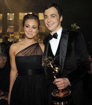 "The Big Bang Theory" actor Jim Parsons, right, winner of the Emmy for best actor in a comedy series is joined by castmate Kaley Cucco at the 63rd Primetime Emmy Awards Governors Ball on Sunday, Sept. 18, 2011 in Los Angeles. (AP Photo/Chris Pizzello)