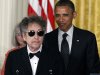 FILE - In this May 29, 2012, file photo, President Barack Obama stands Bob Dylan before awarding Dylan the Medal of Freedom during a ceremony in the East Room of the White House in Washington. Dylan said Monday, Nov. 5, 2012, during a concert, that he thinks President Barack Obama is going to win the election by a landslide.(AP Photo/Charles Dharapak, File)