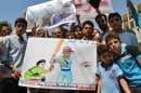 Syrians with sign reading, "Just do it" during a demonstration for international action on August 30, 2013 in Kfar Nubul