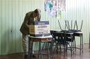 Solis casts his vote at a polling station during the presidential election in San Jose