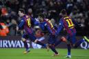 FC Barcelona's Lionel Messi, from Argentina, left, reacts after scoring with his teammates Rafinha, center, and Neymar, from Brazil, right, against Villarreal during a Spanish La Liga soccer match at the Camp Nou stadium in Barcelona, Spain, Sunday, Feb. 1, 2015. (AP Photo/Manu Fernandez)