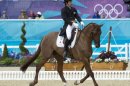 Japan's Yoshiaki Oiwa on Noonday de Conde competes in the dressage event of