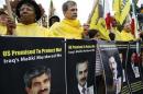 Supporters of Iranian opposition group Mujahadin-e-Khalq rally against Iraq's PM Maliki hours before he is scheduled to meet with U.S. President Obama, outside White House in Washington