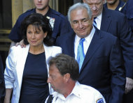 Former International Monetary Fund leader Dominique Strauss- Kahn leaves New York State Supreme court with his wife Anne Sinclair, Friday, July 1, 2011, in New York. A judge has agreed to free Strauss-Kahn without bail or home confinement in the sexual assault case against him. The criminal case against him stands. (AP Photo/Louis Lanzano)
