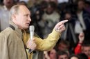 Russian President Putin addresses the audience during a forum of pro-Kremlin youth groups at lake Seliger