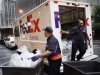 FedEx employees deliver packages, Thursday, Sept. 22, 2011 in New York. FedEx is cutting its earnings expectations for the fiscal year ending in May due to slowing global economic growth.  (AP Photo/Mark Lennihan)