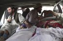 Bodies of Afghan women are brought to a hospital in the Alingar district of Laghman province, east of Kabul, Afghanistan, Sunday, Sept 16, 2012. According to Afghan officials, airstrikes by NATO planes killed eight women and girls in Laghman province. Villagers from Alingar district drove the bodies to the provincial capital, claiming they were killed by NATO aircraft while they were out gathering firewood before dawn. (AP Photo/Khalid Khan)