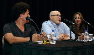 British musician Phil Collins, center, talks to guests …