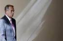 U.S. Speaker of the House John Boehner walks to his weekly news conference on Capitol Hill in Washington