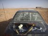 An assault rifle is seen on a vehicle at a checkpoint in Wadi Dinar, Libya, Tuesday, Sept. 20, 2011. A push to capture Gadhafi's hometown of Sirte and the mountain enclave of Bani Walid has stalled as well-armed forces loyal to the fugitive leader fight back fiercely with rockets and other heavy weaponry. Libya's new rulers have frequently claimed gains only to find their forces beaten back. Grafitti reads Libya  Feb.17, the date of their revolution. (AP Photo/Alexandre Meneghini)