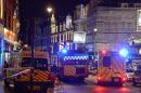 Emergency services attend the scene at the Apollo Theatre in Shaftesbury Avenue, central London, Thursday, Dec. 19, 2013. A theater in central London partially collapsed Thursday night during a performance at the height of the Christmas season, with police saying there were "a number" of casualties. (AP Photo/PA, Dominic Lipinski) UNITED KINGDOM OUT, NO SALES, NO ARCHIVE PRESS ASSOCIATION