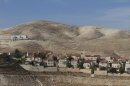 A view of the Jewish West Bank settlement of Maaleh Adumim, with E1, background, near Jerusalem, Sunday, Dec. 2, 2012. Israel on Sunday roundly rejected the United Nations' endorsement of an independent state of Palestine, and announced it would withhold more than $100 million owed to the Palestinians in retaliation for their successful statehood bid. Israel has a master plan to build 3,600 apartments and 10 hotels on the section of territory east of Jerusalem known as E1. The Palestinians have warned that such construction would kill any hope for the creation of a viable state of Palestine. (AP Photo/Ariel Schalit)