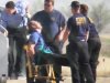 Emergency workers tend to a JetBlue captain that had a "medical situation" during a Las Vegas-bound flight from JFK International airport, Tuesday, March 27, 2012, in Amarillo, Texas. Passengers said the pilot screamed that Iraq or Afghanistan had planted a bomb on the flight, was locked out of the cockpit, and then tackled and restrained by passengers. The pilot who subsequently took command of the aircraft elected to land in Amarillo at about 10 a.m., JetBlue Airways said in a statement. (AP Photo/Steve Douglas)