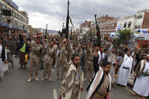 Shiite rebels, known as Houthis, hold up their weapons&nbsp;&hellip;