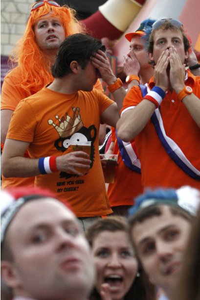 Netherlands fans react as they watch Euro 2012 soccer match between Netherlands and Denmark in the fan zone in Kiev