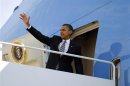U.S. President Barack Obama waves from Air Force One at Andrews Air Force Base near Washington