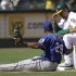 Oakland Athletics' Coco Crisp, right, adjusts his helmet after stealing third base against Texas Rangers third baseman Adrian Beltre (29) in the eighth inning of a baseball game on Thursday, Sept. 22, 2011, in Oakland, Calif. (AP Photo/Ben Margot)
