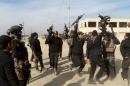 Iraqi security forces chant slogans in the city of Ramadi