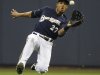Milwaukee Brewers' Carloz Gomez makes a sliding catch on a ball hit by the Florida Marlins' Emilio Bonifacio during the fifth inning of a baseball game, Saturday, Sept. 24, 2011, in Milwaukee. (AP Photo/Jeffrey Phelps)