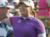 Shanshan Feng, right, hugs her caddie after finishing the 18th hole with a score of 6-under-par to win the Wegmans LPGA Championship at Locust Hill Country Club in Pittsford, N.Y., Sunday, June 10, 2012. (AP Photo/Derek Gee)