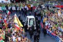 Pope Benedict XVI arrives on his Popemobile for World Youth Day 2011