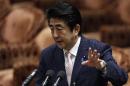 Japan's PM Abe speaks during a lower house budget committee session at the parliament in Tokyo