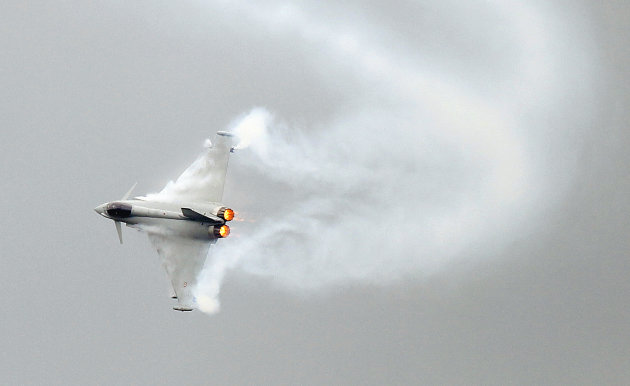 A Eurofighter Typhoon performs its demonstration flight, on the first day of the Paris air show, at Le Bourget airport, Monday June 20, 2011.(AP Photo/Francois Mori)