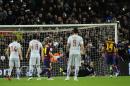 FC Barcelona's Messi, from Argentina, centre, scores a penalty against Atletico's goalkeeper Jan Oblak during a Quarterfinal Copa del Rey soccer match at the Camp Nou stadium in Barcelona, Spain, Wednesday, Jan. 21, 2015. (AP Photo/Manu Fernandez)
