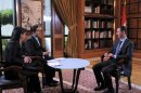Syria's President Bashar al-Assad attends an interview with Syrian television channel al-Ikhbariya in Damascus