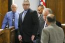 Former Marine Cpl. Eddie Ray Routh, center, appears in court on the opening day of his capital murder trial at the Erath County Donald R. Jones Justice Center, Wednesday, Feb. 11, 2015, in Stephenville, Texas. Routh, 27, of Lancaster, Texas, is charged with the 2013 deaths of former Navy SEAL Chris Kyle and his friend Chad Littlefield at a shooting range near Glen Rose, Texas. (AP Photo/The Dallas Morning News, Tom Fox, Pool)
