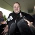 FILE - In this Feb. 22, 2012 file photo, Kim Dotcom, the founder of the file-sharing website Megaupload, comments after he was granted bail and released in Auckland, New Zealand.  On his way up, he fooled them all: journalists, judges, investors and companies. Then the man who renamed himself Kim Dotcom finally did it. With an eye for get-rich schemes and an ego gone wild, he parlayed his modest computing skills into a mega-empire, becoming the fabulously wealthy computer maverick he had long claimed to be. (AP Photo/New Zealand Herald, Brett Phibbs, File) NEW ZEALAND OUT, AUSTRALIA OUT