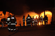 Israeli firefighters try to extinguish a fire that erupted after a rocket fired from Lebanon hit a chicken coop in a village in northern Israel, early Tuesday, Nov. 29, 2011. Rockets fired from Lebanon struck northern Israel early Tuesday for the first time in more than two years, drawing a burst of Israeli artillery fire across the tense border, the Israeli military said. (AP Photo/Yaron Kaminsky) ISRAEL OUT