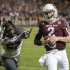 Texas A&M quarterback Johnny Manziel (2) runs from Missouri's Michael Sam (52) during the second quarter of an NCAA college football game on Saturday, Nov. 24, 2012, in College Station, Texas. (AP Photo/Dave Einsel)