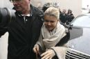 Michael Schumacher's wife, Corinna arrives at the Grenoble hospital, French Alps, Saturday, Jan. 4, 2014, where former seven-time Formula One champion Michael Schumacher is being treated after sustaining a head injury during a ski accident. Schumacher has been in a medically induced coma since Sunday, when he struck his head on a rock while on a family vacation. (AP Photo/Claude Paris)