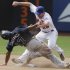 New York Mets' Daniel Murphy, right, attempts to tag out Atlanta Braves' Jose Constanza (17) who steals second base during the seventh inning of a baseball game on Sunday, Aug. 7, 2011, at Citi Field in New York. Murphy was injured on the play. (AP Photo/Frank Franklin)