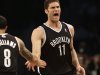 Brooklyn Nets' Brook Lopez, right, reacts after scoring against the Chicago Bulls during the first quarter of Game 1 of a first-round series of the NBA basketball playoffs, Saturday, April 20, 2013, in New York. (AP Photo/Seth Wenig)