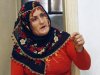 In this July 29, 2011 photo, Naciye Tokova, a Kurdish mother and housewife, who was sentenced to seven years in jail for helping rebels who are described by Turkey as terrorists, speaks during an interview in her home in Kurtalan, Siirt in southeastern Turkey. The key piece of evidence against Tokova, who is illiterate, was the sign that she held up at a protest. It said: "Either a free leadership and free identity, or resistance and uprising until the end." The punishment stems from the Turkish state's homegrown narrative of terrorism, one that pre-dates the Sept. 11, 2001 attacks and is rooted in the bloody legacy of Kurdish rebel chief Abdullah Ocalan, jailed since 1999. Activists counter that Tokova was denied the right to free assembly and expression and hardly qualifies as a terrorist accomplice.(AP Photo/Burhan Ozbilici)