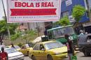 A banner reading 'Ebola is real, Protect yourself and your family', warns people of the Ebola virus in Monrovia, Liberia, Saturday Aug. 2, 2014. An Ebola outbreak that has killed more than 700 people in West Africa is moving faster than efforts to control the disease, the head of the World Health Organization warned, as presidents from the affected countries met Friday in Guinea's capital. (AP Photo/Abbas Dulleh)