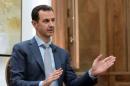 Syria's President Bashar al-Assad speaks during an interview with Yahoo News