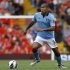 Manchester City's Nigel de Jong runs with the ball during their English Premier League soccer match against Liverpool at Anfield in Liverpool