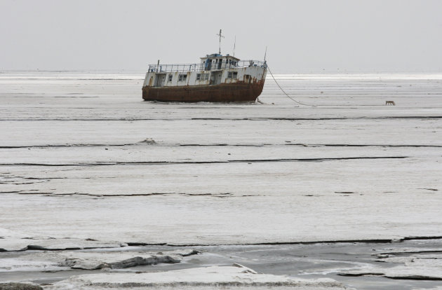 An abandoned ship is stuck in the solidified salts of the Oroumieh Lake, some 370 miles (600 kilometers) northwest of the capital Tehran, Iran, Friday, April 29, 2011. (AP Photo/Vahid Salemi)