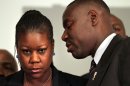 Trayvon Martin's mother Sybrina Fulton, left, listens to the family attorney Benjamin Crump, during a news conference at the Washington Convention Center in Washington, Wednesday, April 11, 2012. A law enforcement official says that charges are being filed in the shooting death of Trayvon Martin. The official with knowledge of the investigation says a prosecutor will announce charges against George Zimmerman on Wednesday at 6 p.m. Zimmerman's arrest is also expected soon. (AP Photo/Jacquelyn Martin)