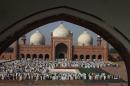 Pakistani Muslims attend a mass prayer for Eid al-Adha in Lahore