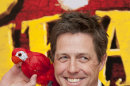 British actor, Hugh Grant, poses with a parrot at the UK premiere of The Pirates! In an Adventure with Scientists, at a central London venue, Wednesday, March 21, 2012. Hugh Grant is stepping away from his usual romantic fare _ to walk the plank. The British actor is starring in 